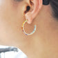 Boucles d'oreilles créoles arc-en-ciel octogonales serties sur griffes en or 18 carats